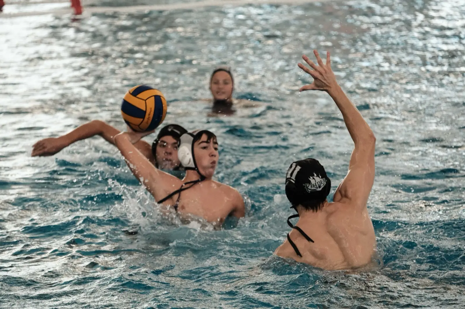 An athlete shooting from close in front of the cage