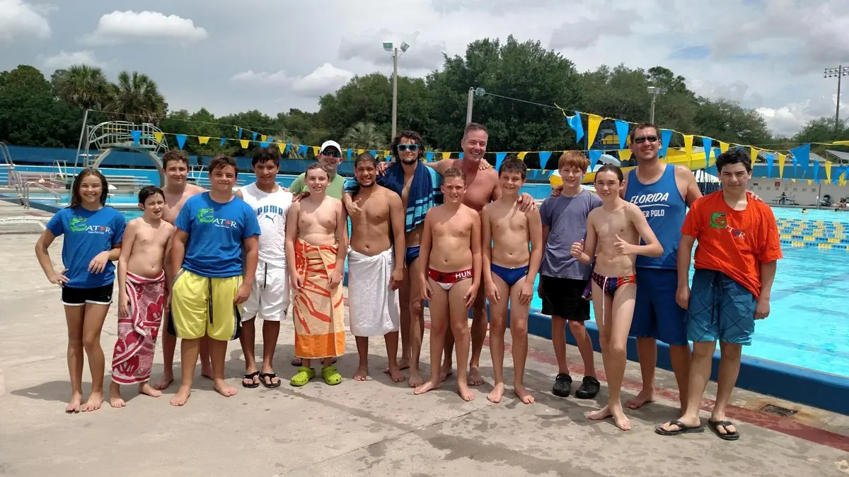 Gator Water Polo athletes and coaches lined up on the deck at the Orange vs Blue games