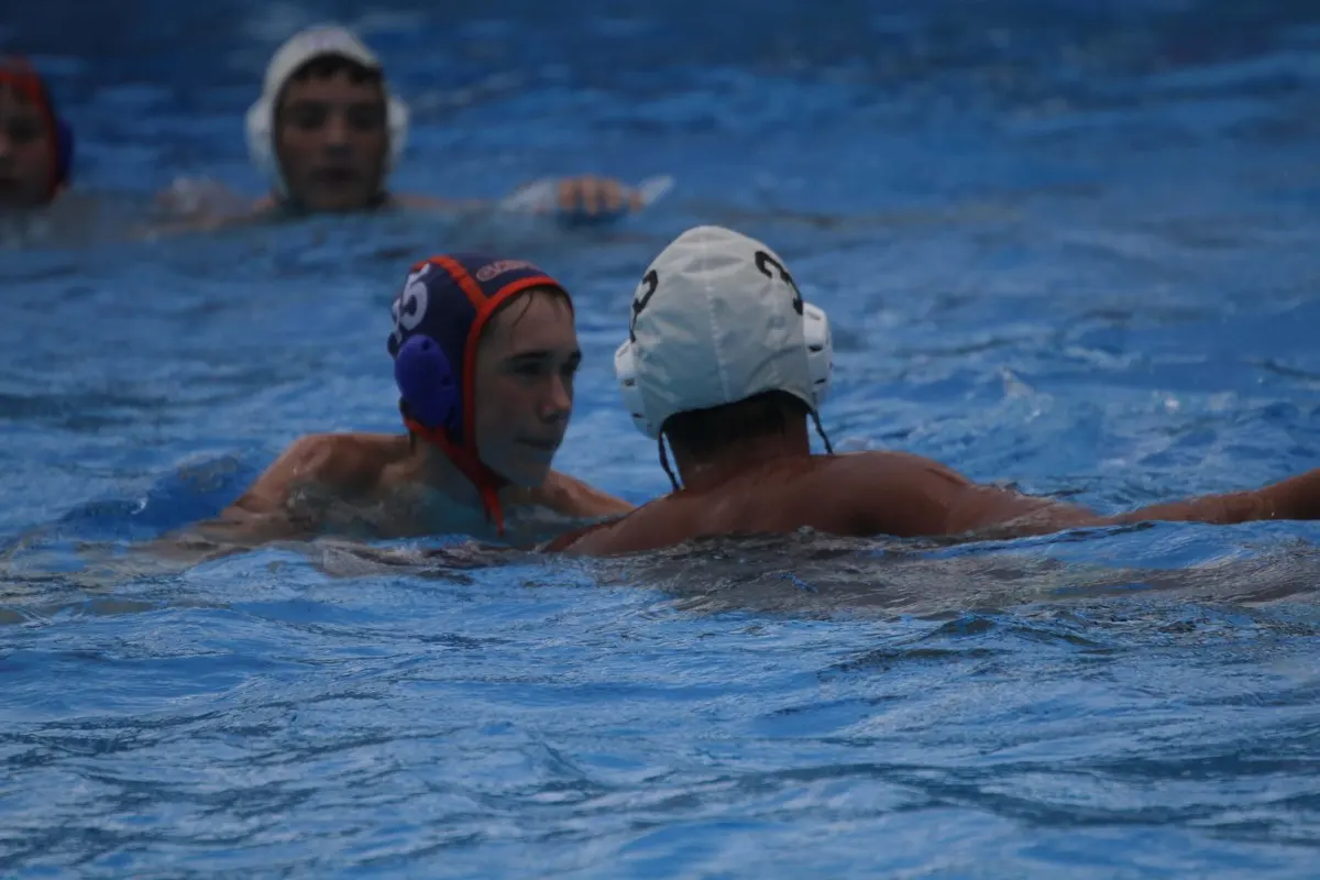Two Gator Water Polo players in the water at the 2015 Sunshine State Games