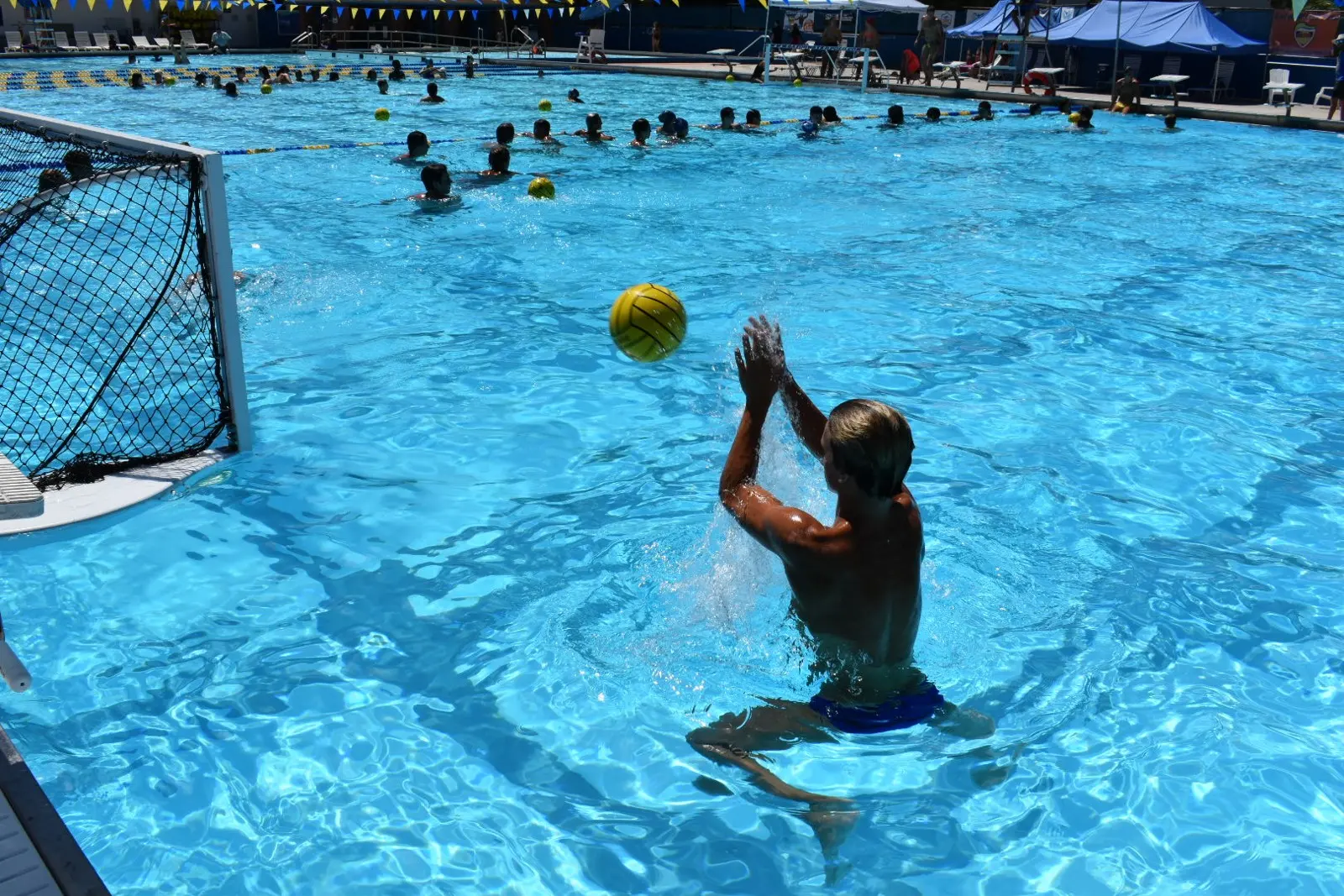A camper rising to shoot at the goal during the 2022 summer event