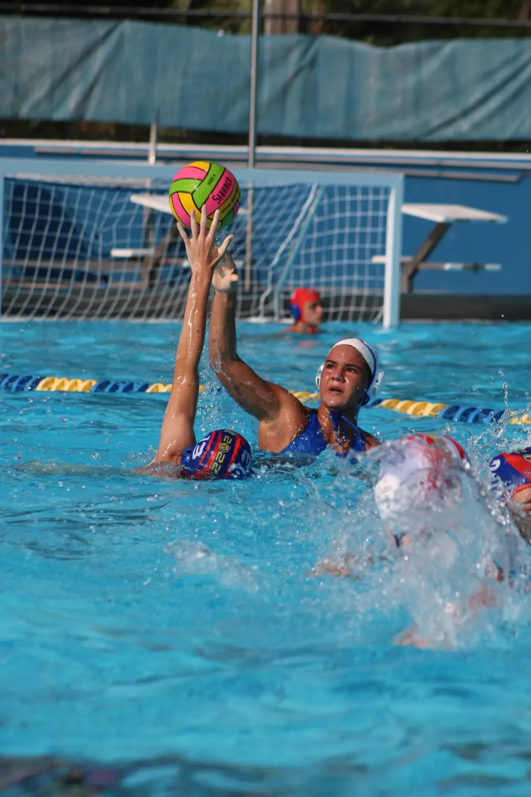 An athlete shooting past a defender at the goal during the 2023 summer event